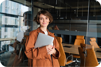 portrait-young-woman-digital-nomad-standing-office-with-laptop-smiling-working-her (3)