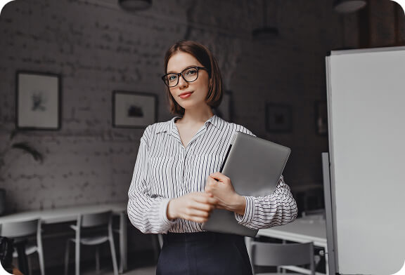 portrait-young-woman-digital-nomad-standing-office-with-laptop-smiling-working-her (15) (1)