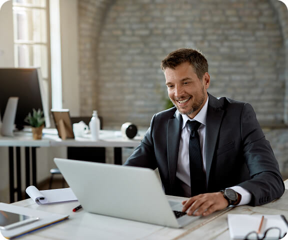 side-view-shot-businessman-typing-laptop-workplace 1 (3) (1)