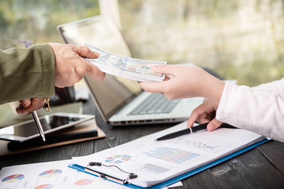 Young accountant in London questioning low accounting salary despite degree