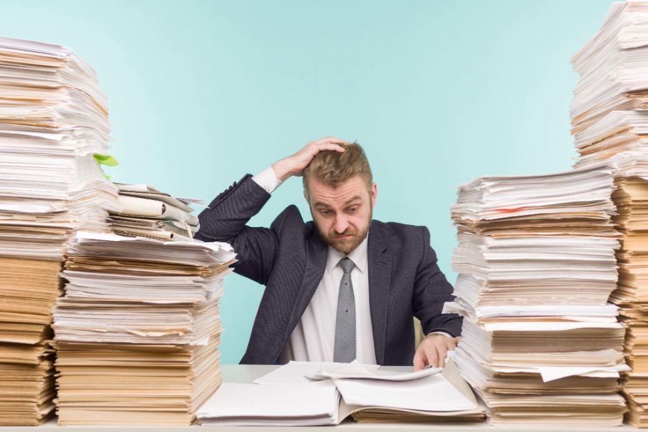Team of accountants preparing tax returns and business reports Team of accountants preparing tax returns and business reports