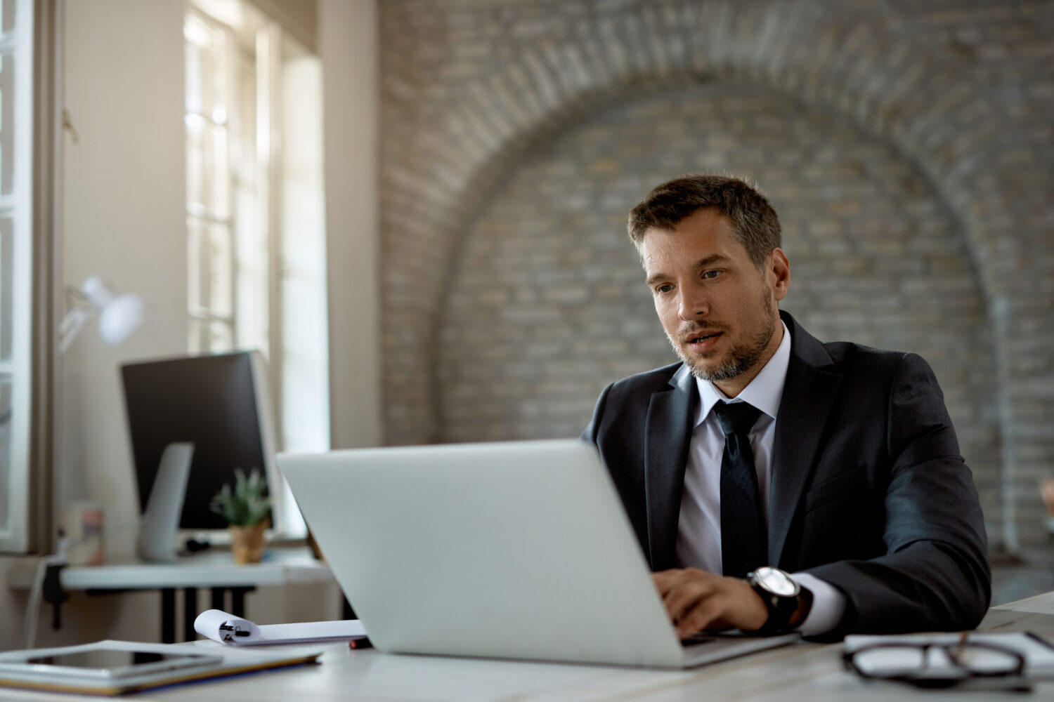 Accountant Accountants reconciling transactions and preparing monthly financial statements